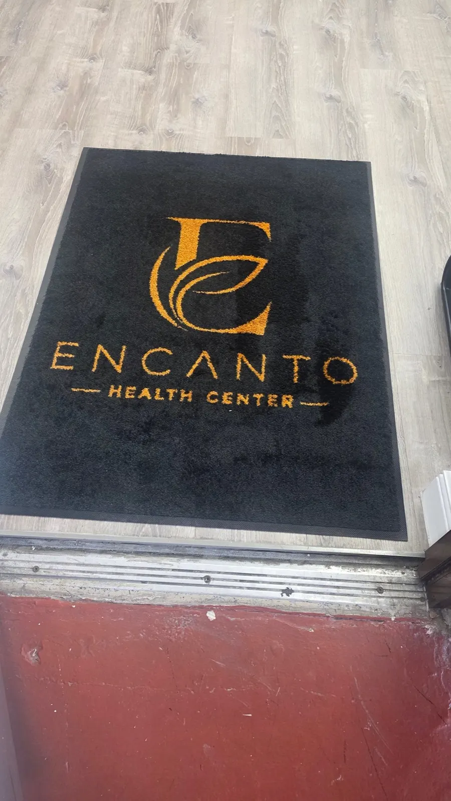 Encanto Health Center logo rug