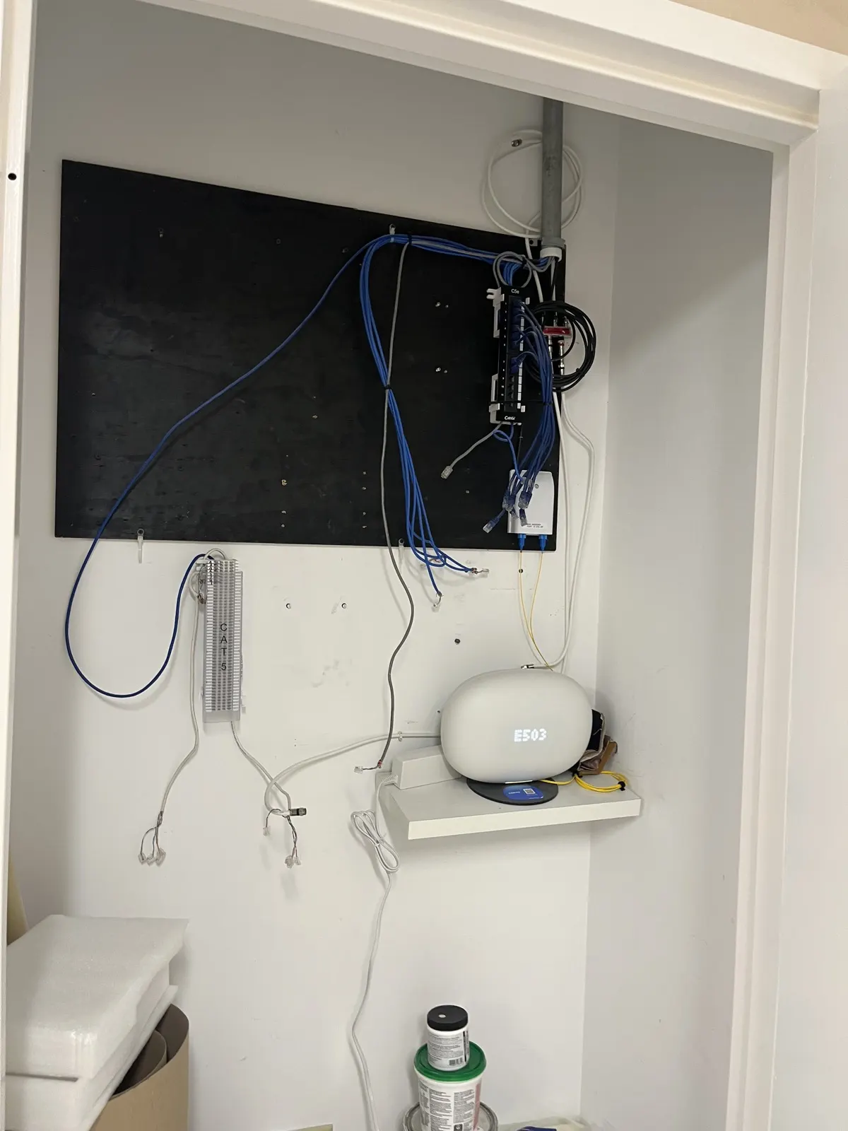 Network closet with CAT6 patch panel and router
